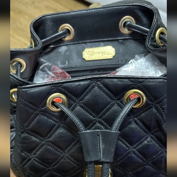 MCM Black Quilted Backpack with Gold Accents